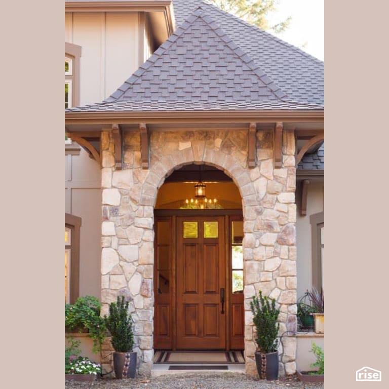 Exterior with Stone Siding by Winsome Construction