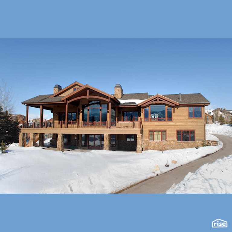 Home exterior with large windows with Stone Siding by Alpen High Performance Products