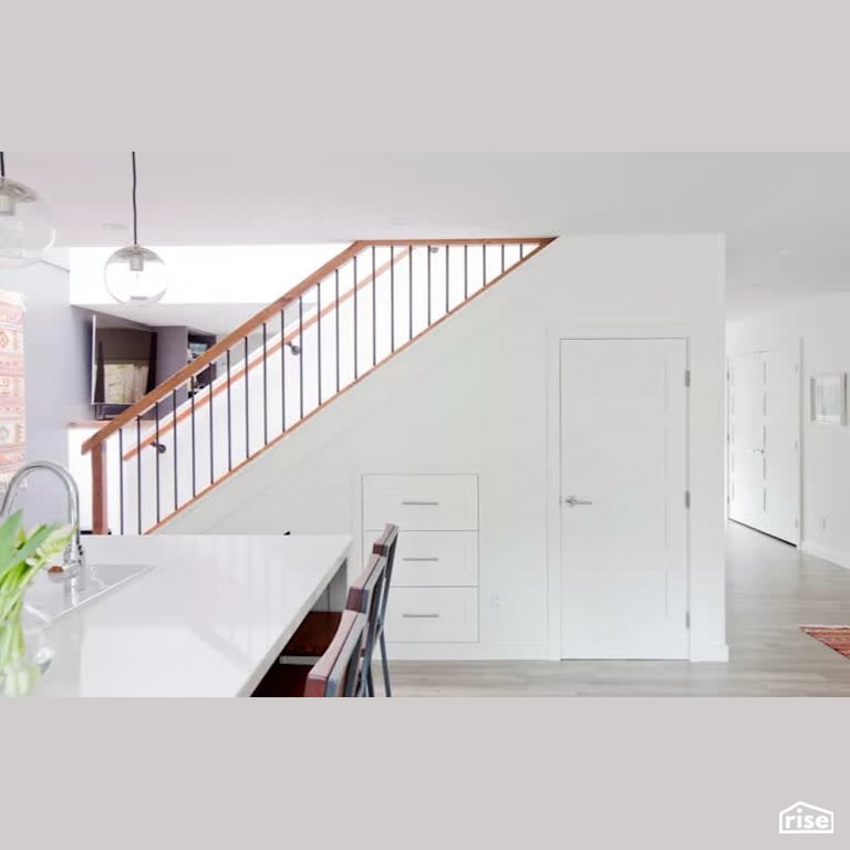 Marine Drive Renovation - Kitchen and Staircase with Laminate Flooring by B Collective Homes