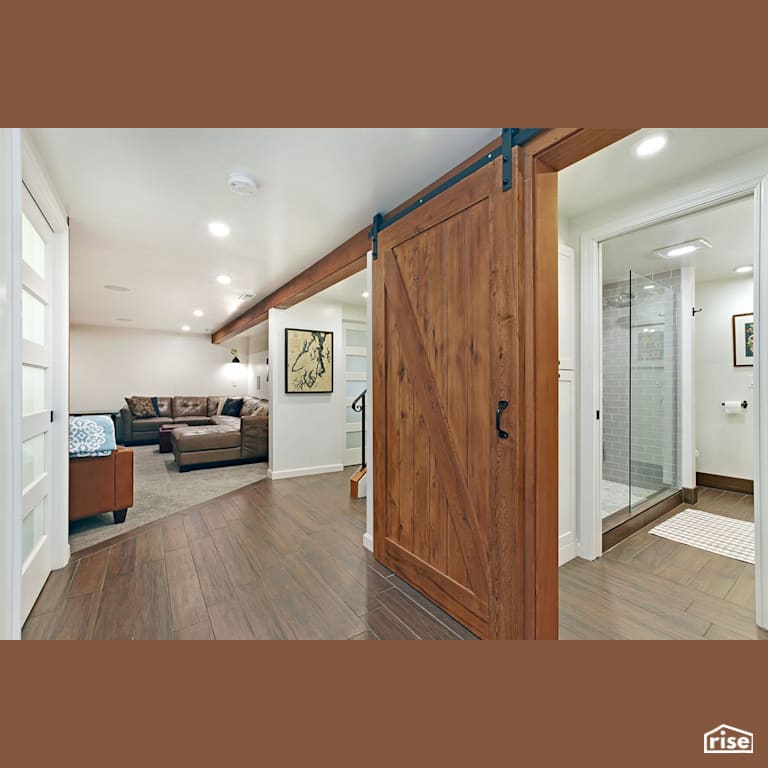 Hall with sliding wood door with Carpeting by Gant Nychay Architecture PLLC