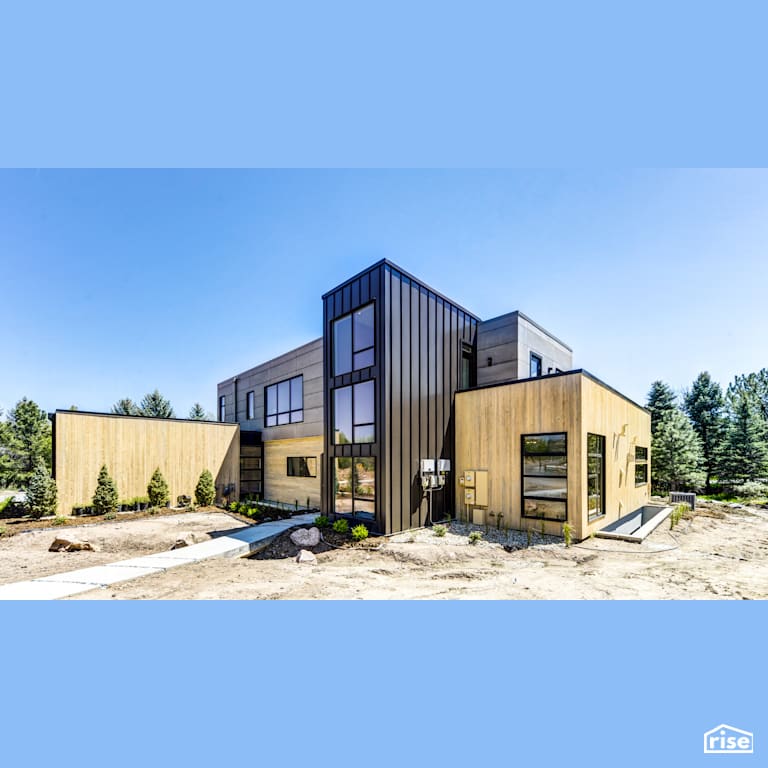 New single family home with black triple glazed windows with Shiplap Wood Siding by Alpen High Performance Products