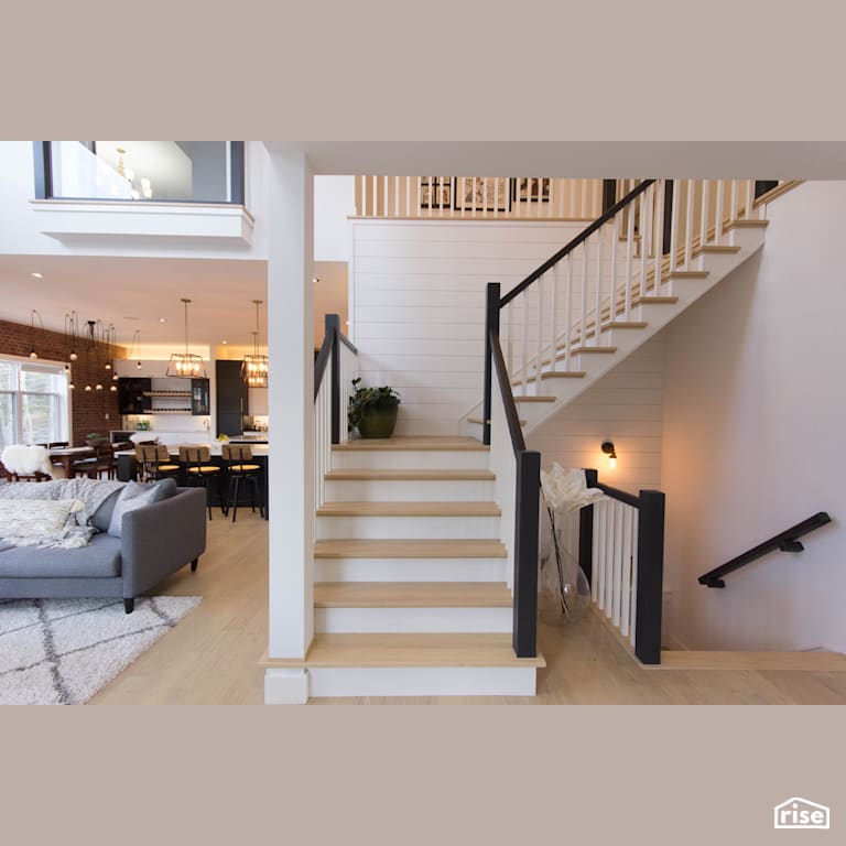 The Broadway - Staircase with Wall Light by Bowers Construction