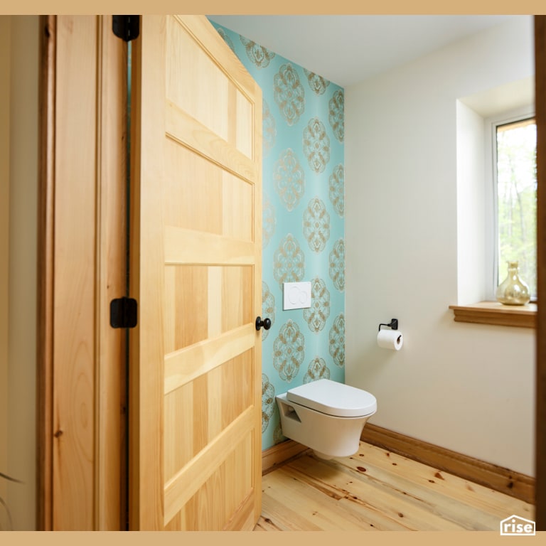 Red Castle Powder Room with Solid Wood Door by The Conscious Builder