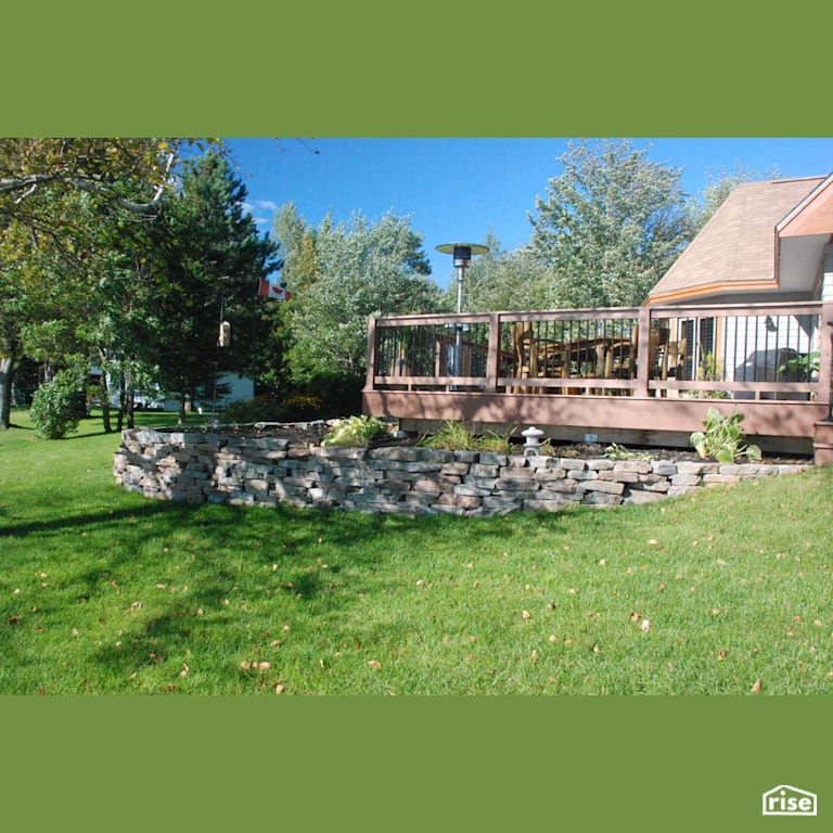Rear Deck with Natural Stones with Pressure Treated Decking by Earthworks Landscape & Design