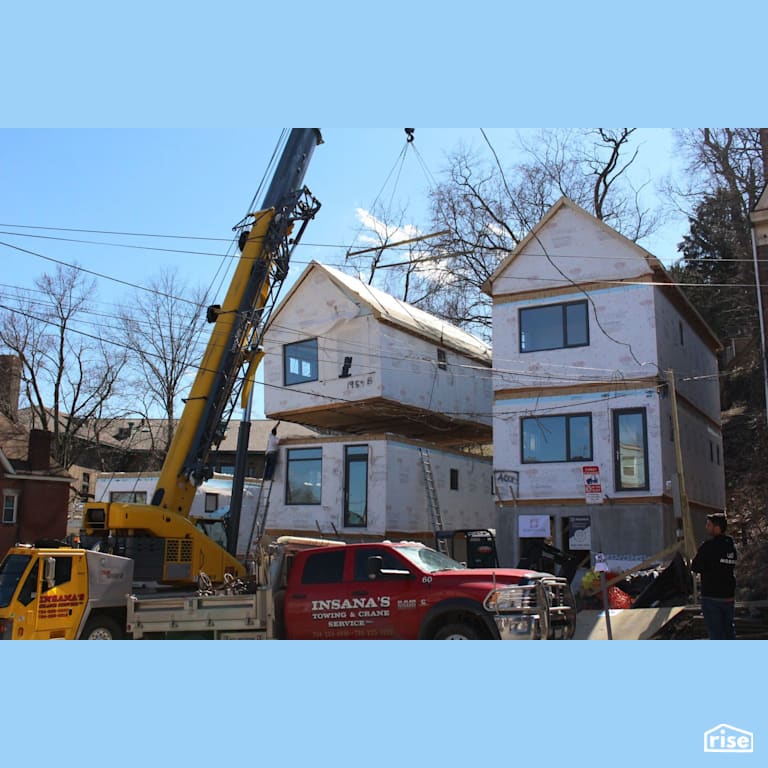 Black Street Development Installing Top Floor Via Crane with Energy Star Exterior Door by Module