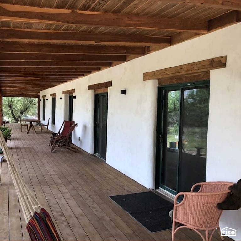Texas compressed earth block home deck with Accent Outdoor Lighting by TexaTerra Block