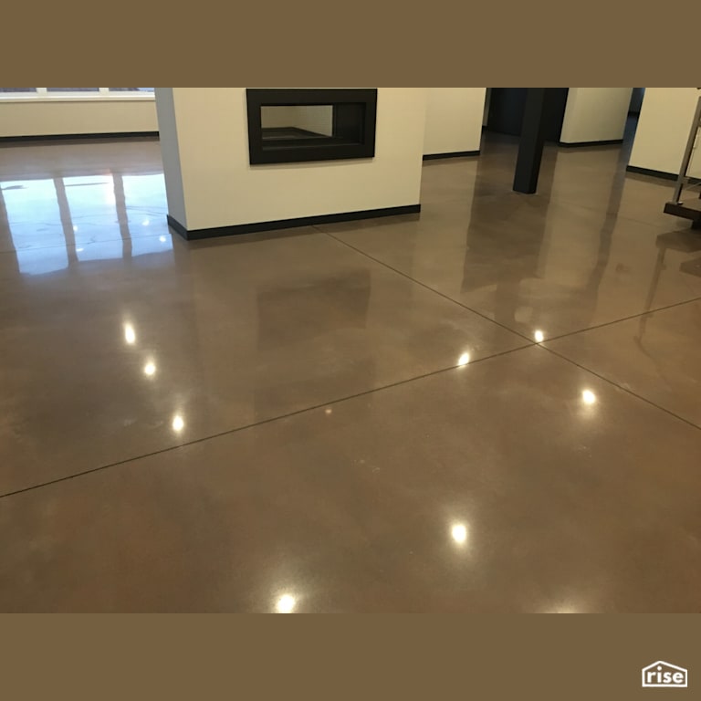 800 Grit cream polish with grey dye with Concrete Flooring by DeltaCrete