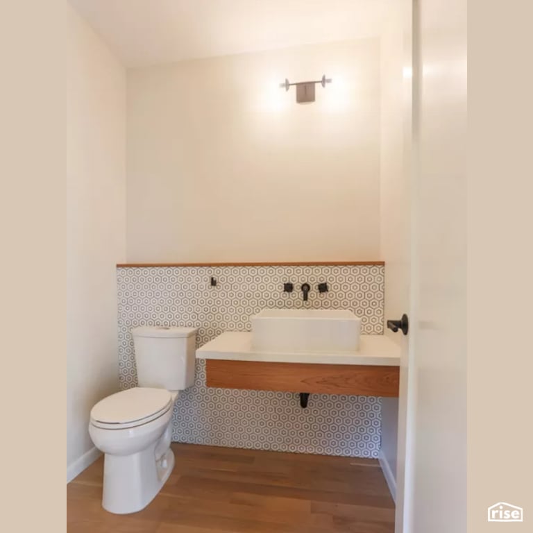 Bathroom with Laminate Flooring by Constructive Builders