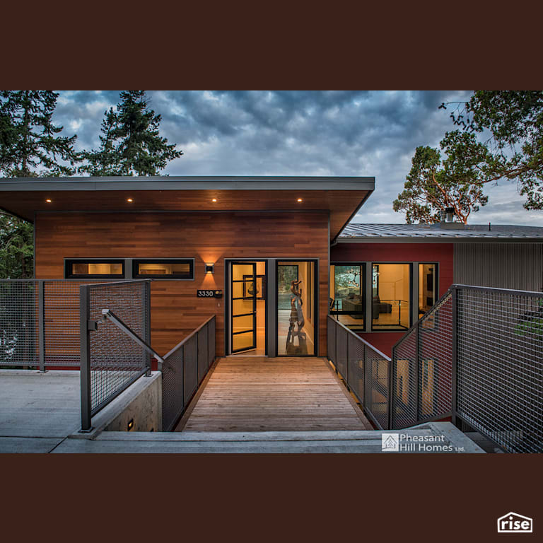 Entrance with Accent Outdoor Lighting by Pheasant Hill Homes Ltd.