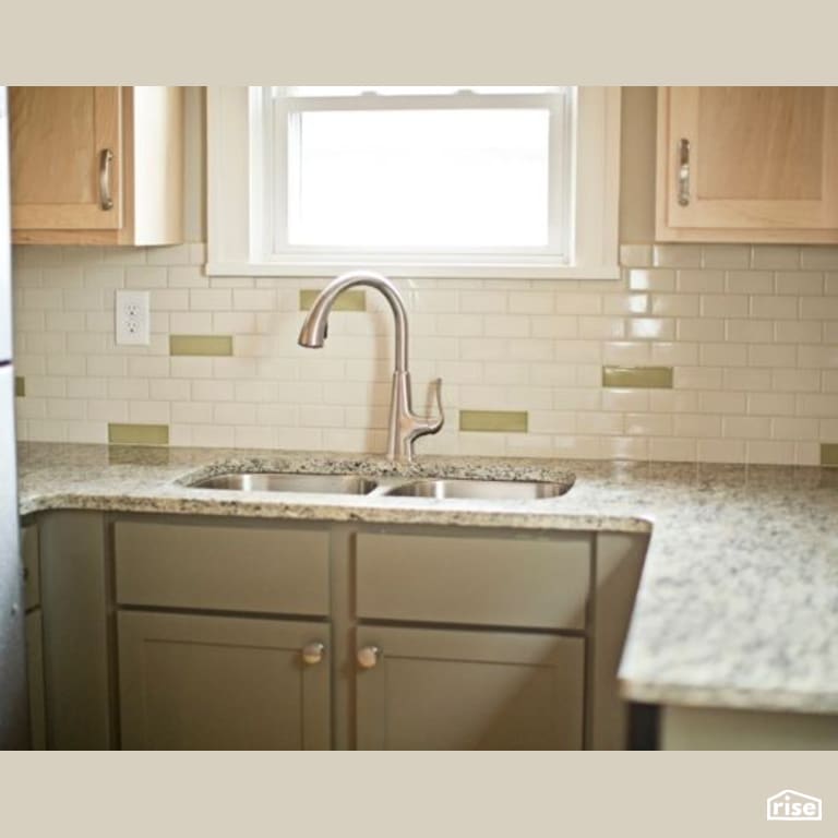 Kitchen with Low-Flow Kitchen Faucet by Constructive Builders