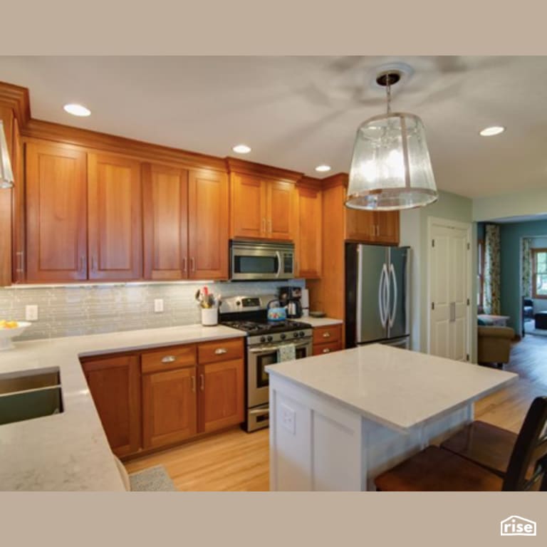 Kitchen with Gas Range by Constructive Builders