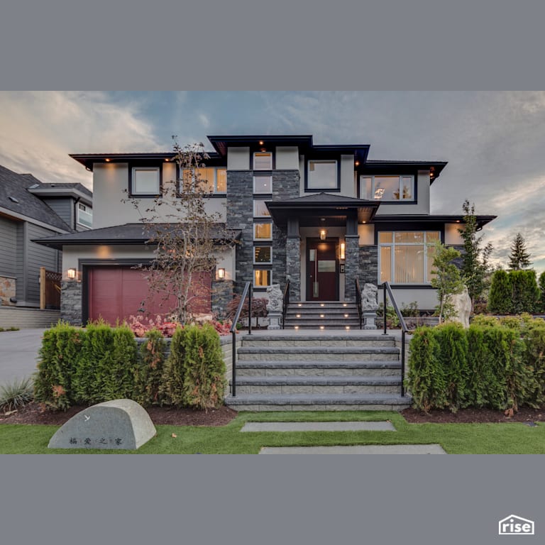 Executive Elegance - Exterior with Accent Outdoor Lighting by Clay Construction