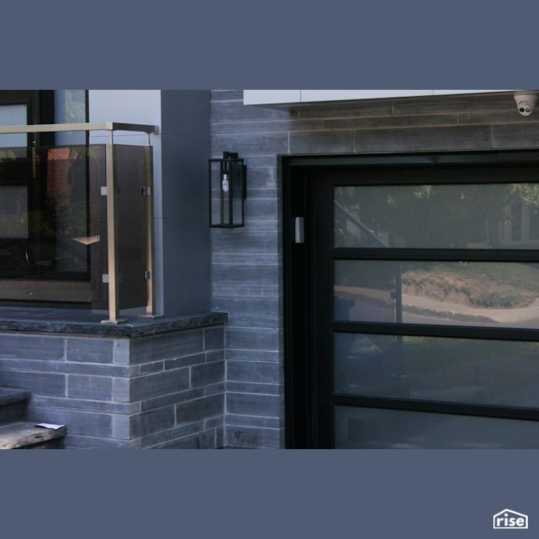 Stone Siding with Accent Outdoor Lighting by Masonal Stone Inc