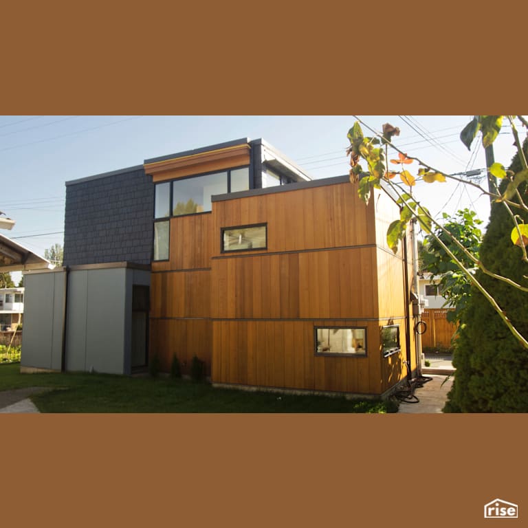 Exterior with Reclaimed Wood Siding by MIZA Architects