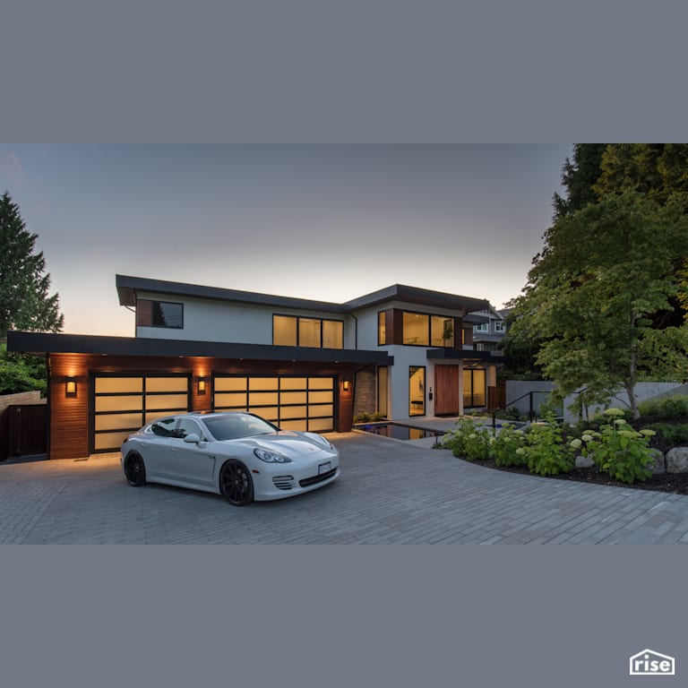 Exterior at Dusk with Stone Veneer Siding by Synthesis Design