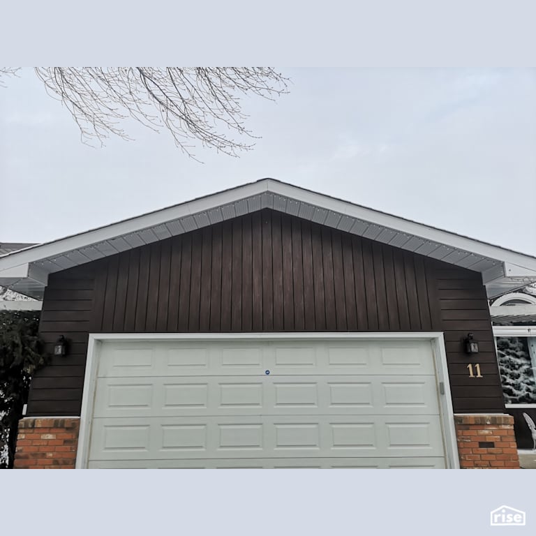 Composite on brick siding with Accent Outdoor Lighting by ChamClad by Chameleon
