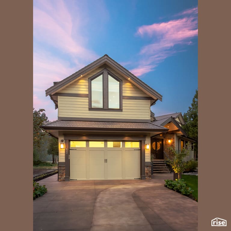 Front Exterior with Accent Outdoor Lighting by My House Design/Build Team Ltd.