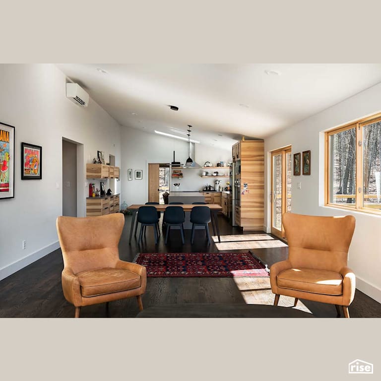 Open concept living room with deck access with Engineered Hardwood by Deltec Homes