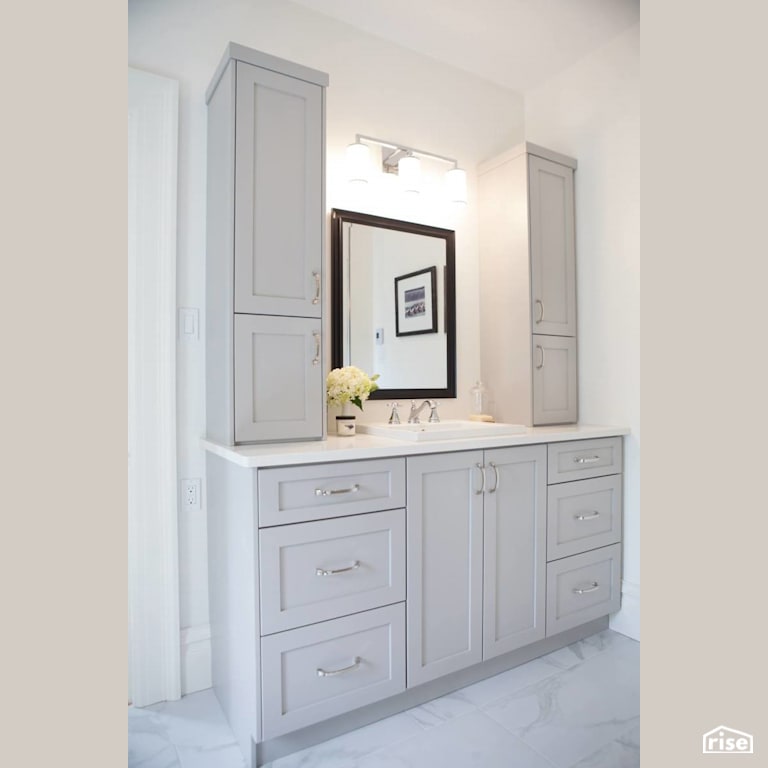 Updated bathroom vanity with grey cabinets with Wall Light by J Russon Construction