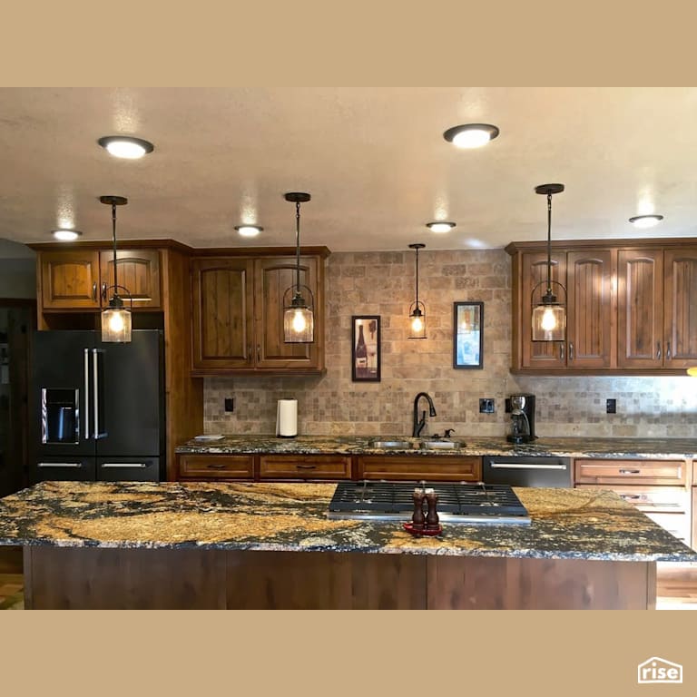 Hardwood cabinet kitchen with gas range in island with Gas Range by Revolve Design Build