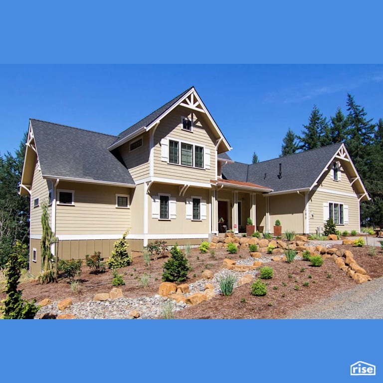 Home Exterior with Wood Mulch by Winsome Construction