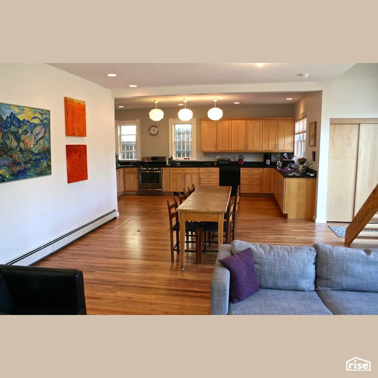 Open concept kitchen with original flooring with Electric Baseboards by Revolve Design Build