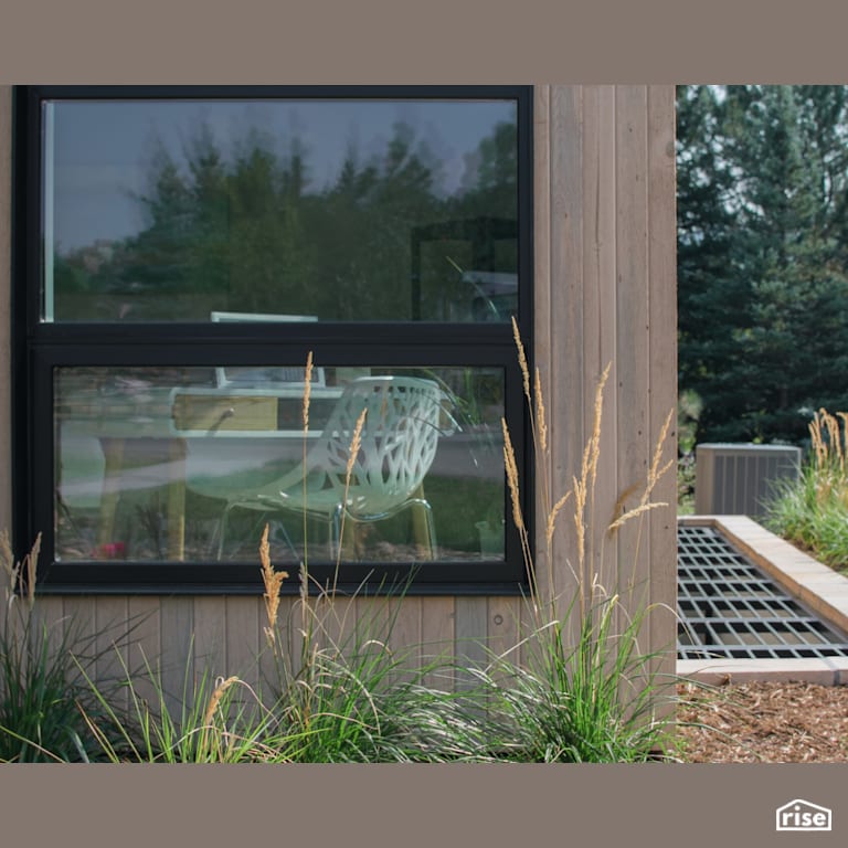All black triple glazed windows accent bleached shiplap wood siding with Shiplap Wood Siding by Alpen High Performance Products