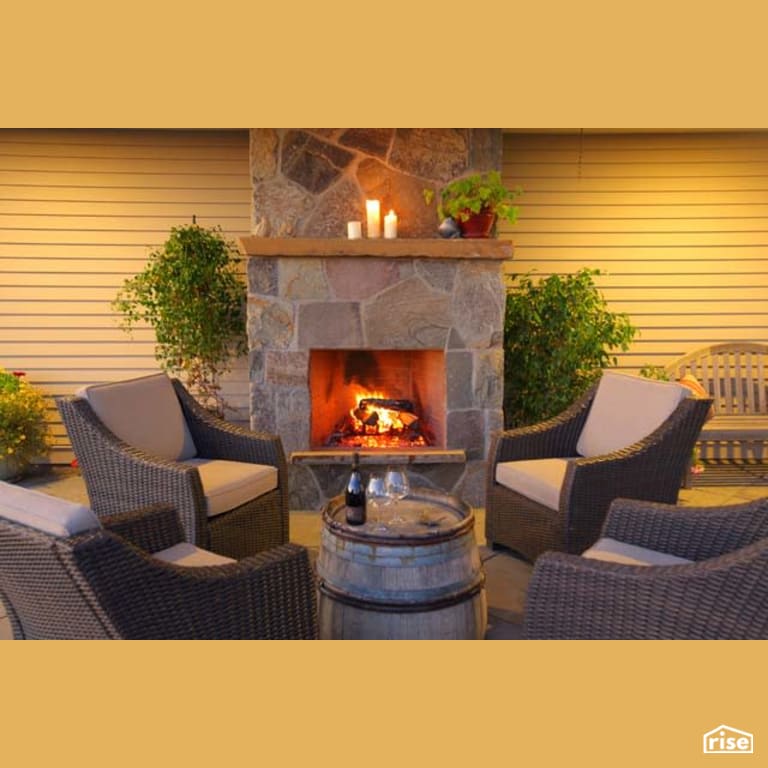 Rear Patio Fireplace with Clapboard Wood Siding by Winsome Construction
