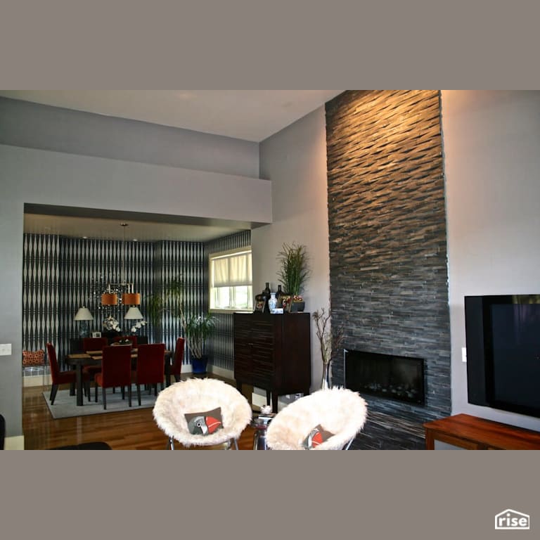 Gas fireplace with floor to ceiling stone feature wall with Integrated LED by Revolve Design Build