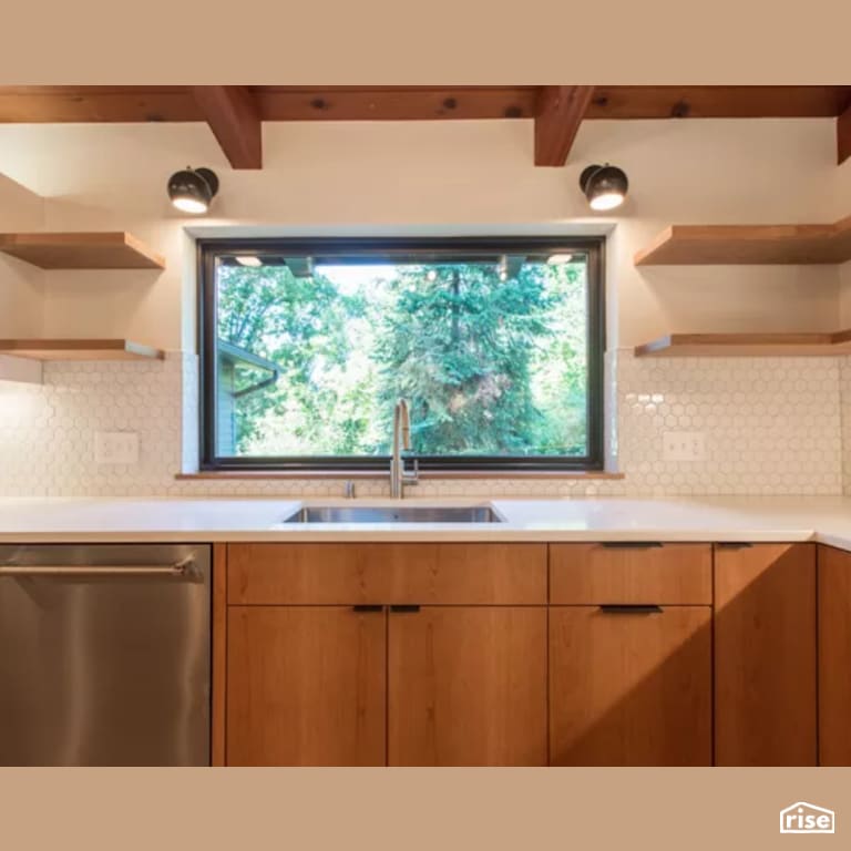 Kitchen with Wood Veneer Cabinet by Constructive Builders