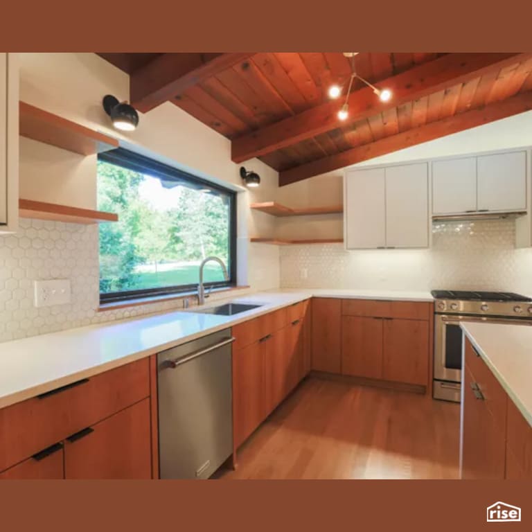 Kitchen with Laminate Flooring by Constructive Builders