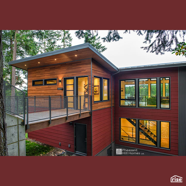Exteriro with Accent Outdoor Lighting by Pheasant Hill Homes Ltd.