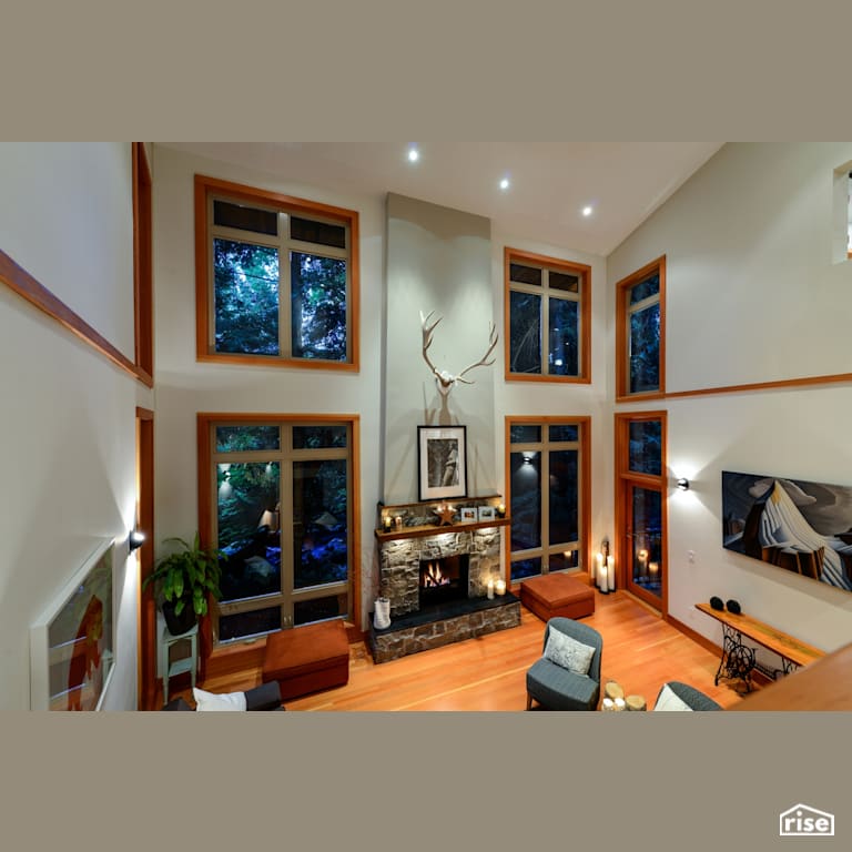 High Ceiling Living Space with Gas Fireplace by Synthesis Design