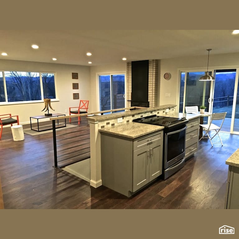 Open concept kitchen with double sliding doors with Integrated LED by Revolve Design Build