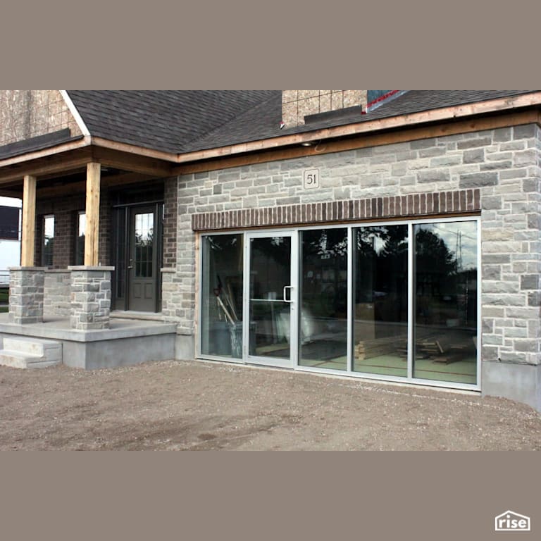 Stone house with commercial doorway with Energy Star Exterior Door by Masonal Stone Inc