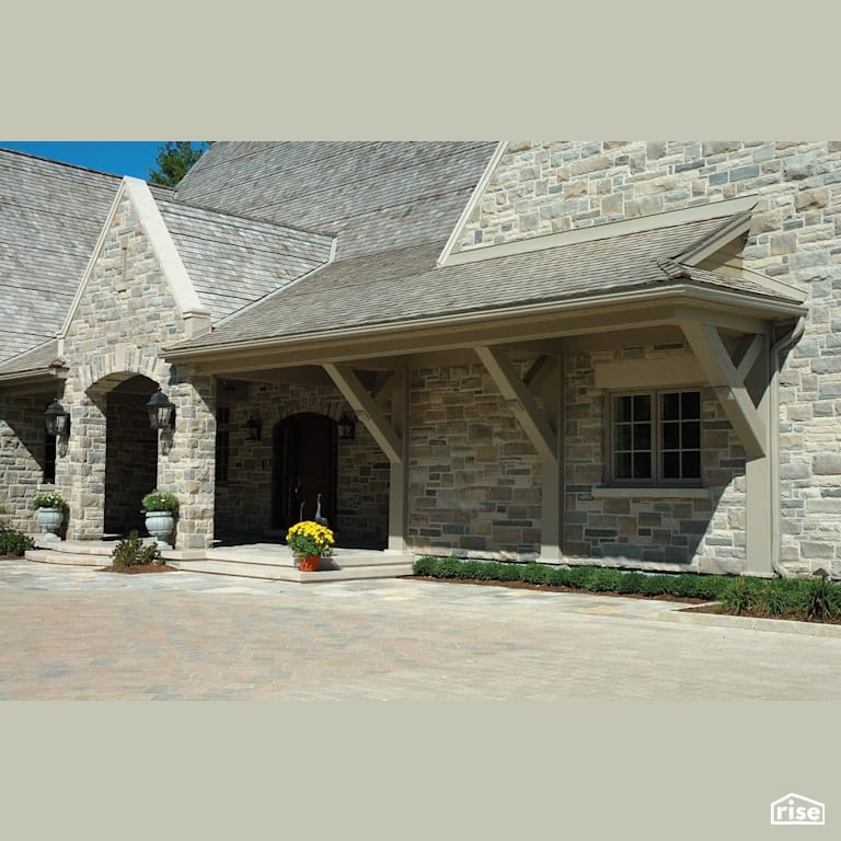 Stone house with large entryway with Solid Wood Door by Masonal Stone Inc