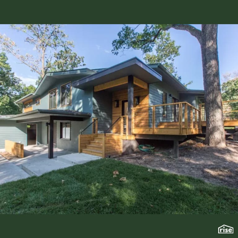 Exterior Front with Wall Mounted Outdoor Lighting by Constructive Builders
