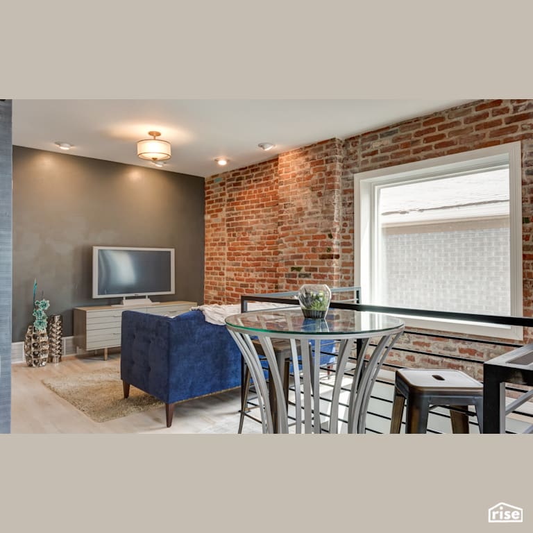 multi-function living area with exposed brick wall with Fixed Window by Alpen High Performance Products