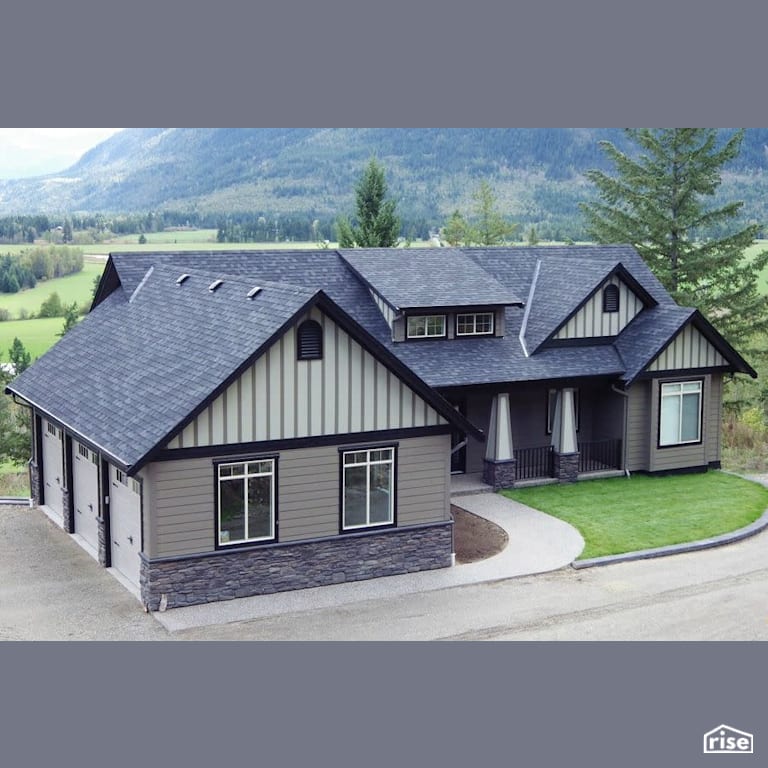 Copper Island Fine Homes - Exteriors with Stone Siding by Copper Island Fine Homes Inc.