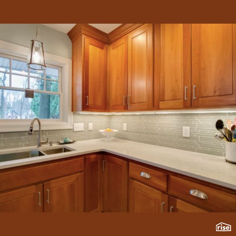 Kitchen with Low-Flow Bathroom Faucet by Constructive Builders
