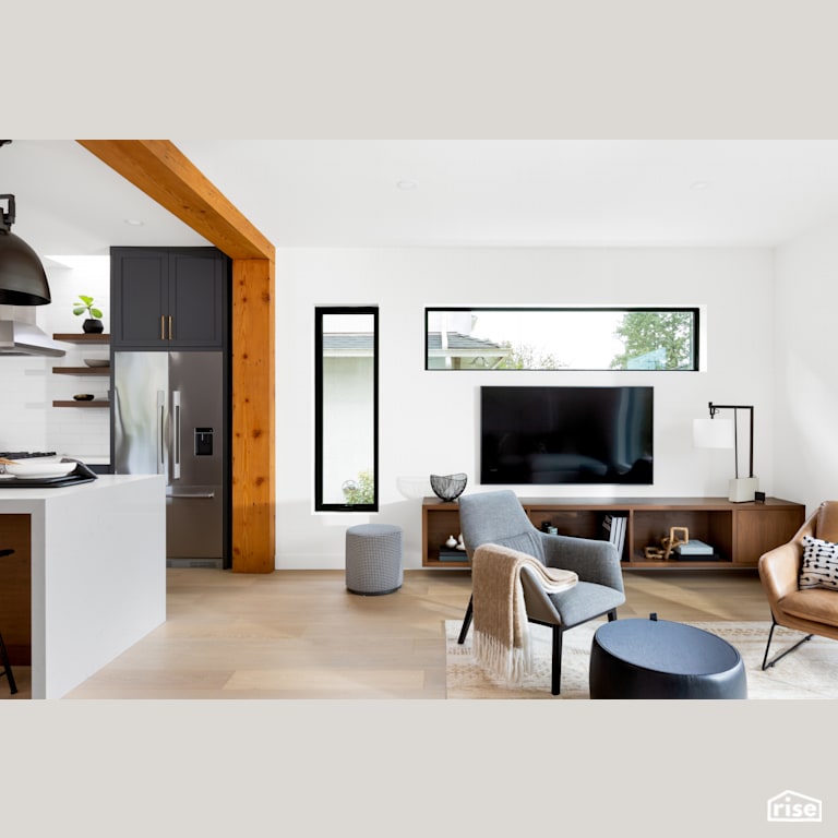 Living Room Next to Open Concept Kitchen with Integrated LED by Synthesis Design