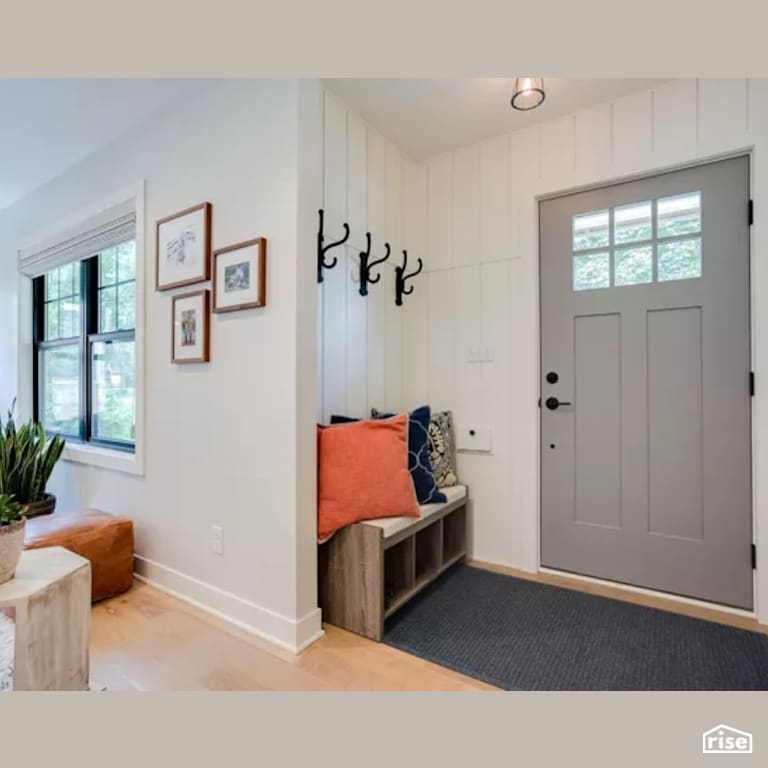 Entryway with Solid Wood Door by Constructive Builders