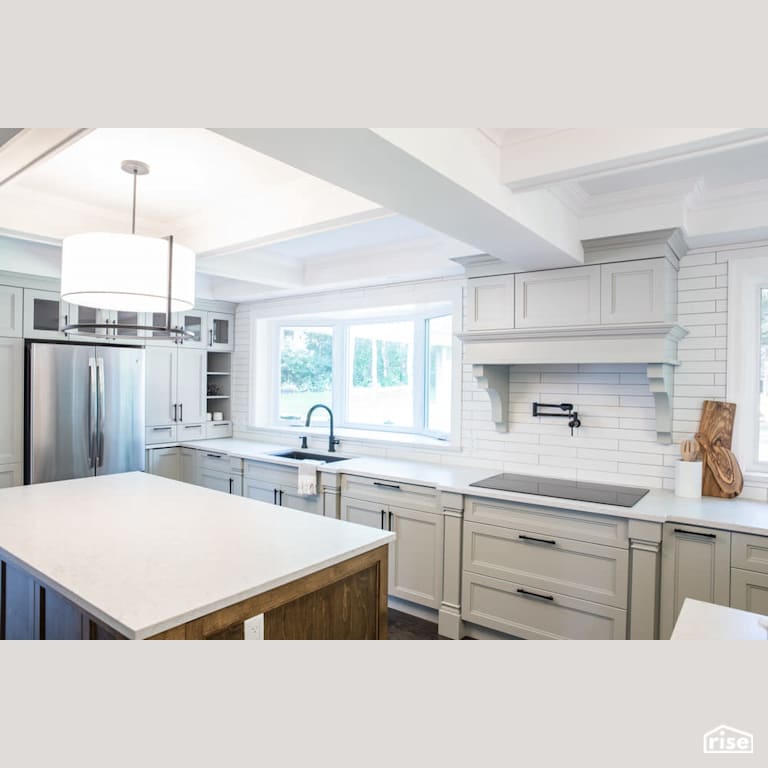 Bright kitchen with solid wood island and white countertop with Low-Flow Kitchen Faucet by Reimagine Designs