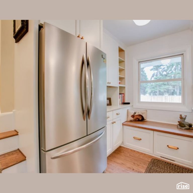 Kitchen with Laminate Flooring by Constructive Builders