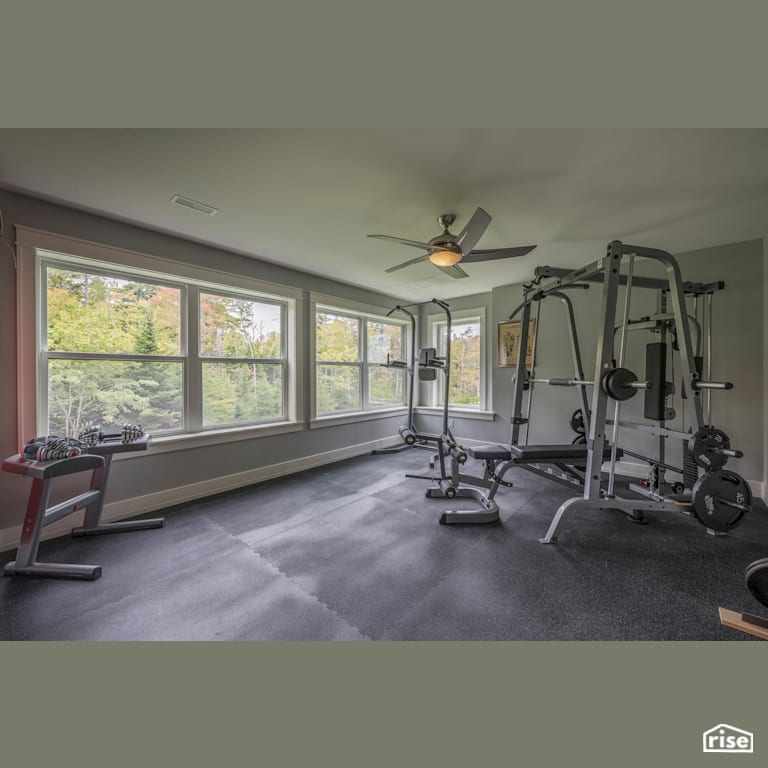 Executive Living - Home Gym with Triple Pane Window by Homes by Highgate