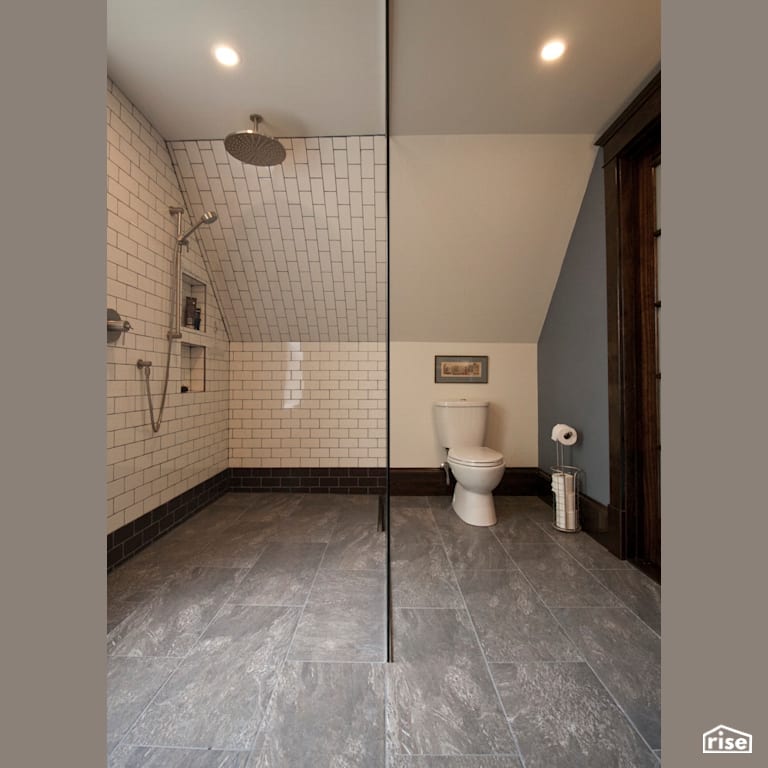 The clean divide between shower and WC with Ceramic Tile Floors by RSI Projects