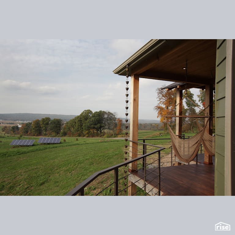 Hillside solar panels with Pressure Treated Decking by Deltec Homes