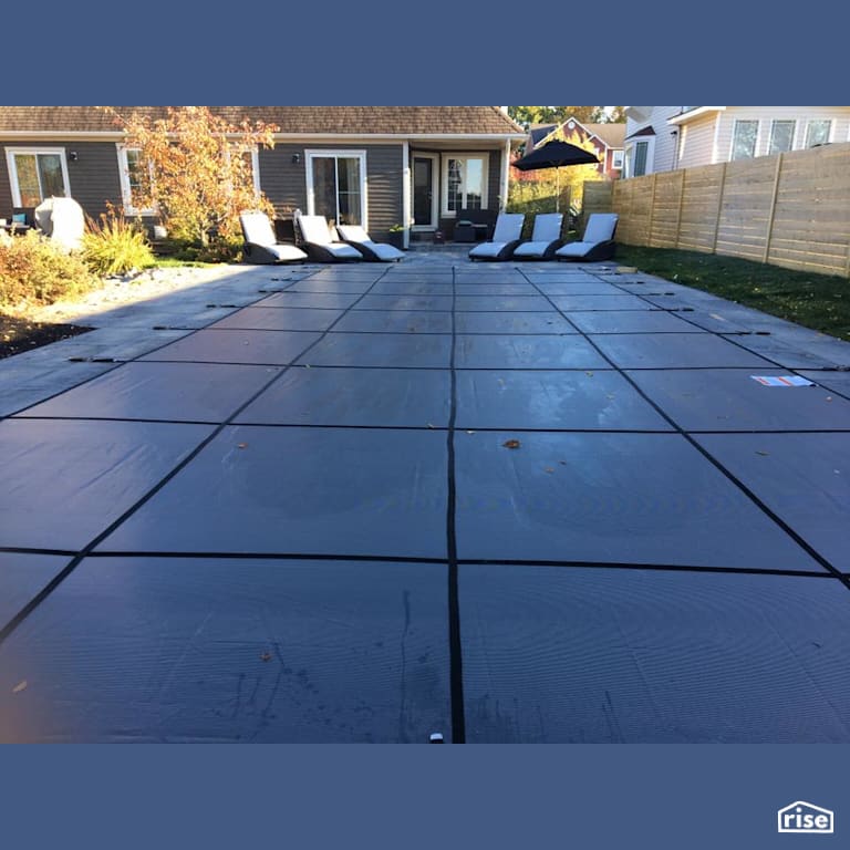 Inground Swimming Pool with Solar Blanket by PoolBoy Inc