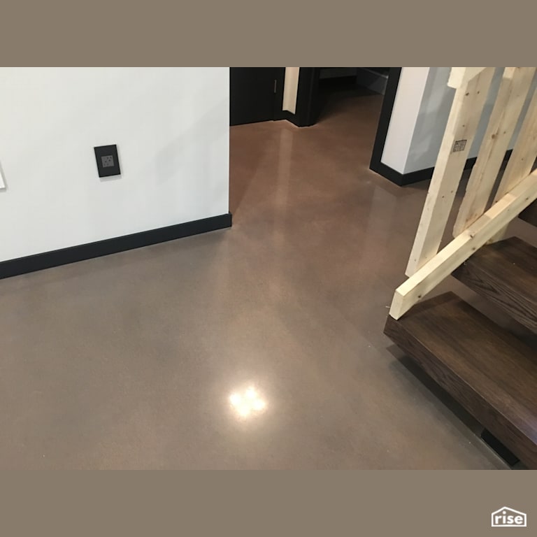 800 Grit cream polish with grey dye with Concrete Flooring by DeltaCrete