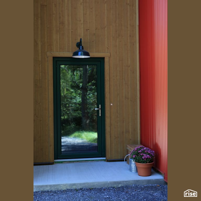 River Road Front Door  with Aluminum Siding by The Conscious Builder